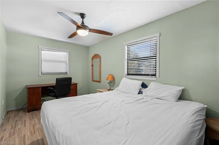 Bedroom with a dedicated workspace by the window - Virtually Edited Image