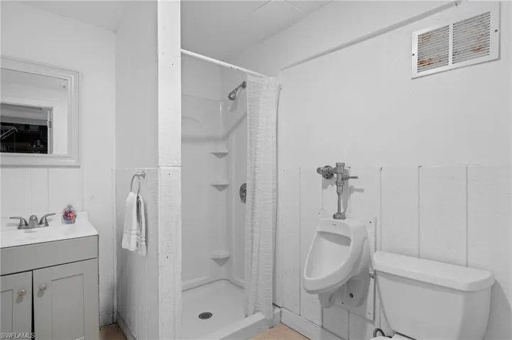 Bathroom with a walk-in shower and vanity -  - Virtually Edited Image