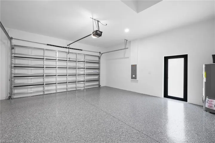 Bathroom with plenty of natural light, a stall shower, a freestanding bath, and a walk in closet