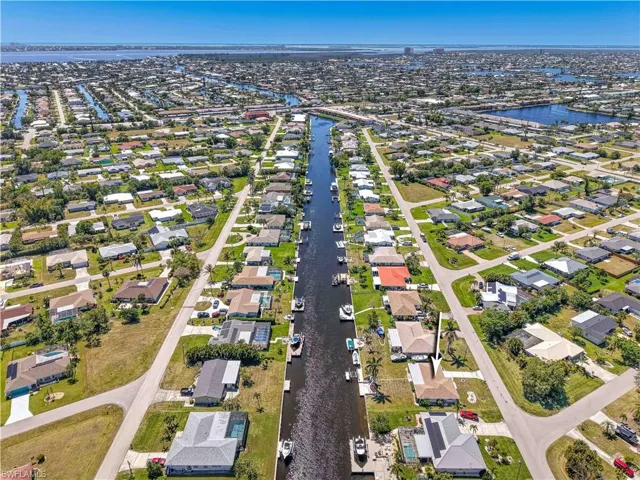 Drone / aerial view featuring a residential view and a water view