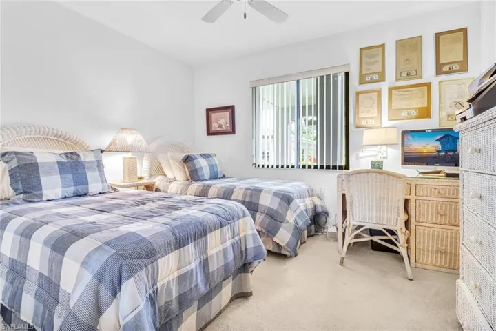 Bedroom featuring light colored carpet and ceiling fan