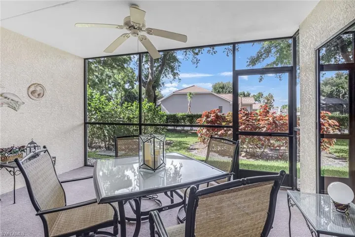 Sunroom / solarium featuring ceiling fan