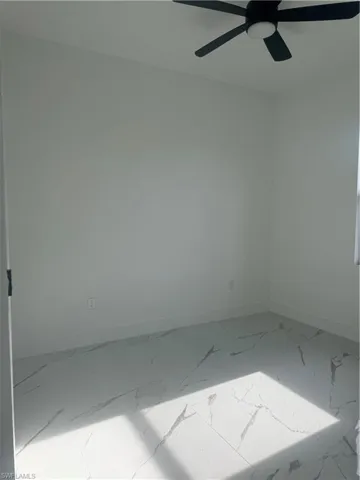 Spare room featuring ceiling fan