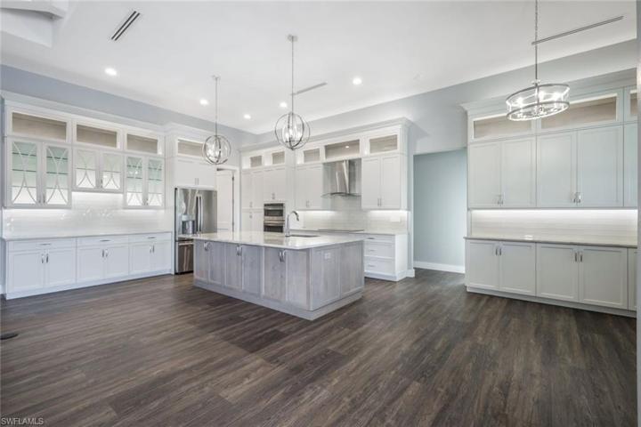 Wood Cabinetry with Pull Out Drawers, Spice Drawer, & Many Custom Inserts