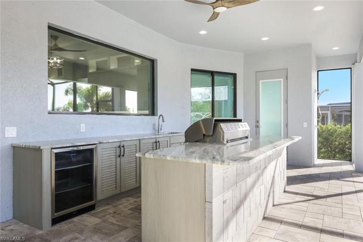 Impressive Grilling Kitchen with Beverage Refrigerator & Sink