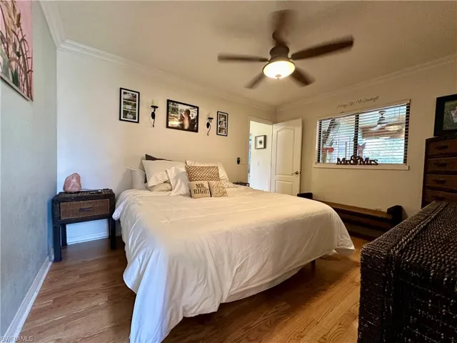 Main Bedroom featuring ornamental molding, ceiling fan, and hardwood / wood-style floors