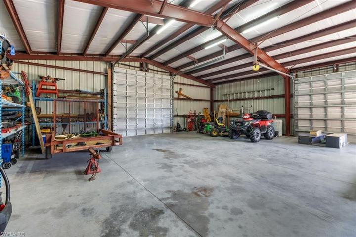 2,400 sq ft Red Iron Metal building/workshop. two 10x10 doors, a 12x12' door, a 9,000 LB car lift