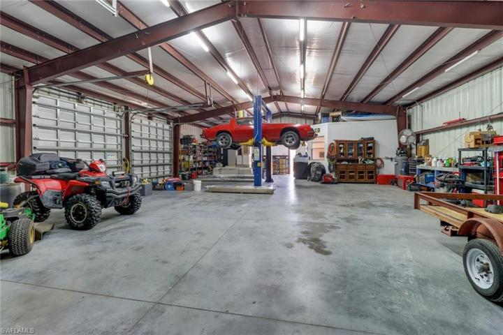 2,400 sq ft Red Iron Metal building/workshop. Two 10x10 doors, a 12x12' door, a 9,000 LB car lift