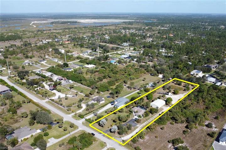 Two separate driveways. One to the home and one to the workshop and back of the lot. Serene Pond at the rear of the property.