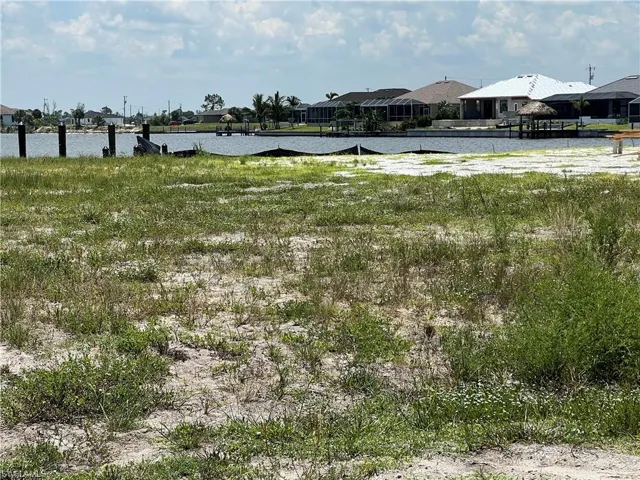 View of Body of water across street from lot where new homes being built