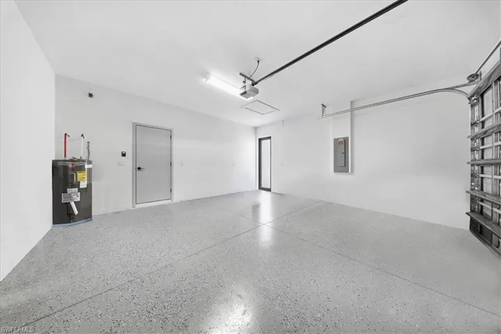 Garage with electric water heater and electric panel