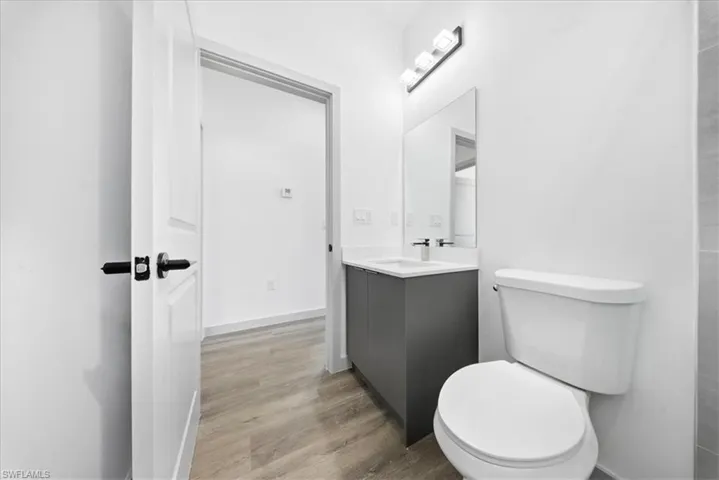 Bathroom featuring vanity and light wood-style floors