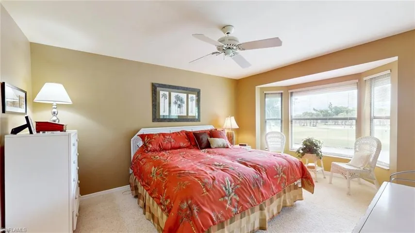 Bedroom with carpet and ceiling fan