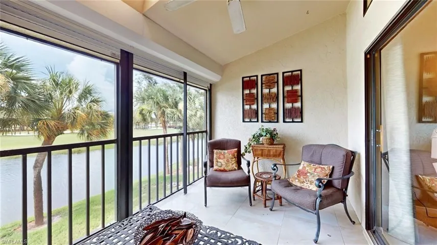 Sunroom / solarium with ceiling fan and vaulted ceiling
