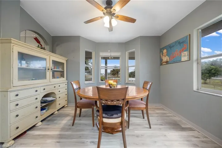 Dining room featuring light wood-style flooring and ceiling fan