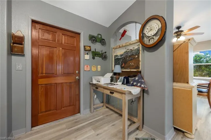 Entryway featuring light wood-style floors and ceiling fan