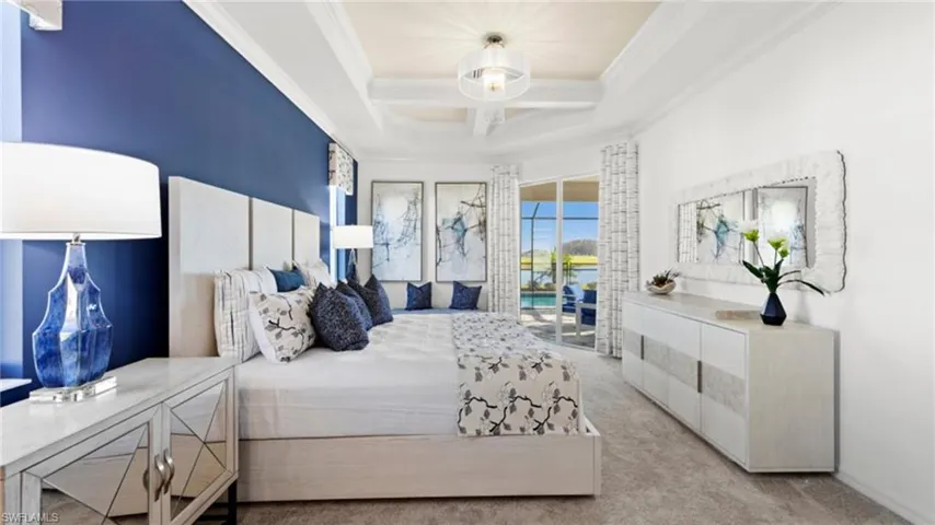 Carpeted bedroom featuring coffered ceiling, baseboards, ornamental molding, and access to outside