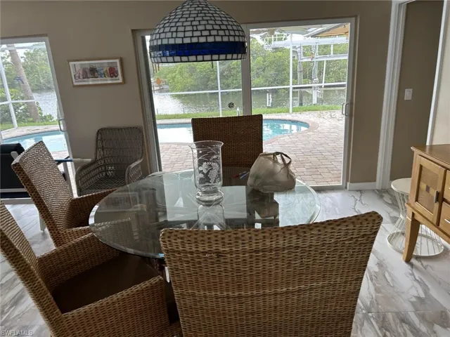 Prior to Milton.  Dining room with a water view and a wealth of natural light