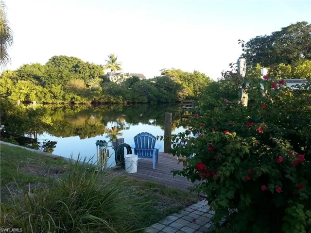 Dock area featuring a water view of intersecting canal with Mound House in the mid background.