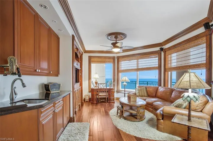The den has detailed mill-work, wood flooring, and stunning views.
