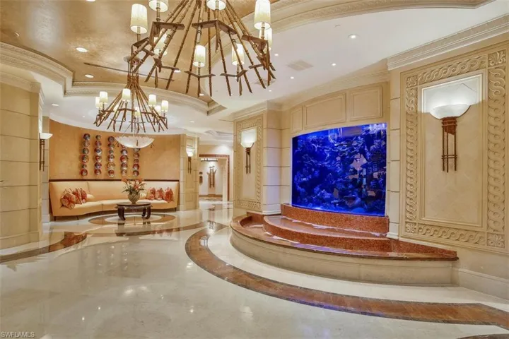 Exquisite lobby for the Belize Condominium with stunning fish tank to captivate guests upon arrival