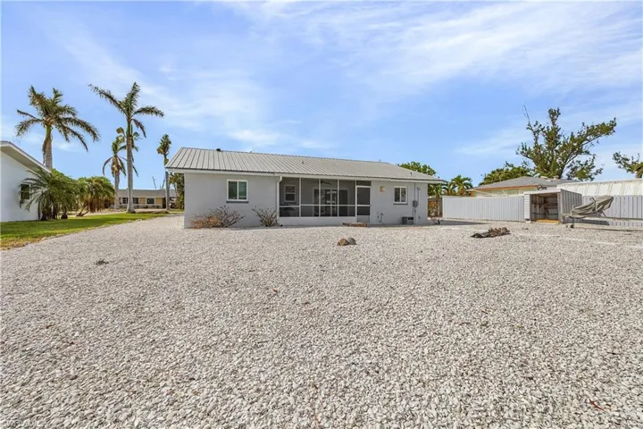 Back of house featuring a sunroom