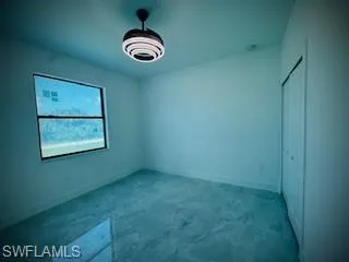 Unfurnished bedroom featuring carpet flooring and a closet