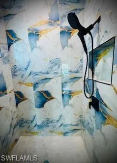 Bathroom view of a marble finish shower