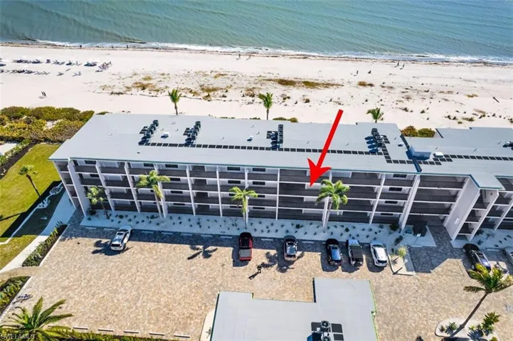 Bird's eye view of apartment complex / building and expansive beach