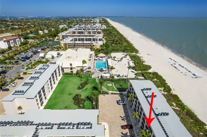 Bird's eye view of a pool area and unending shoreline