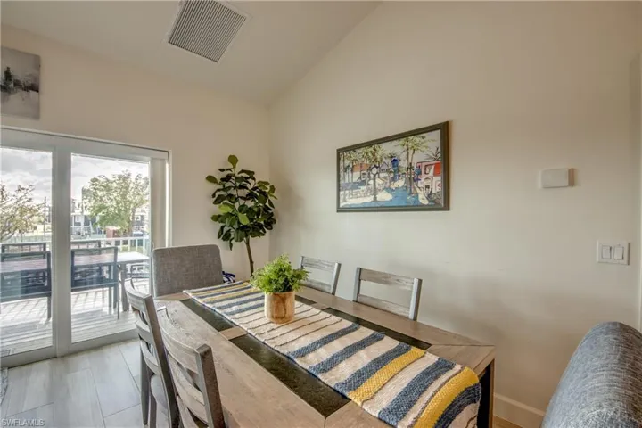 Dining room featuring lofted ceiling