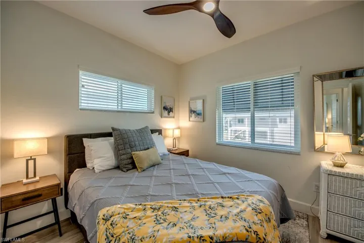 Bedroom featuring hardwood / wood-style floors and ceiling fan