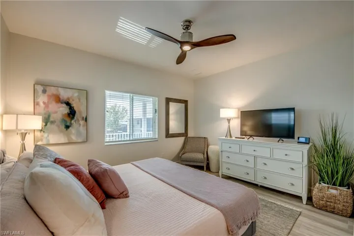 Bedroom featuring ceiling fan and light wood-type flooring
