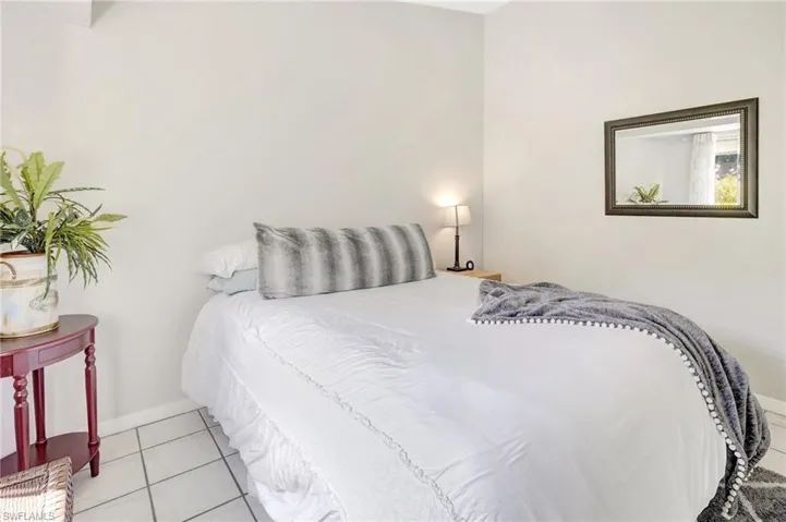 Bedroom with light tile patterned floors