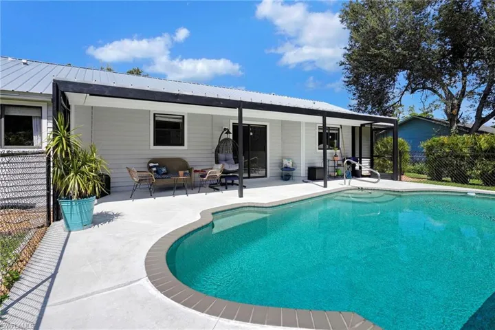 View of pool featuring outdoor lounge area and a patio