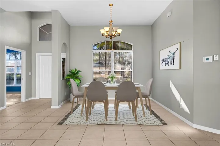 Photo includes virtual staging to showcase the possibility of the dining room.