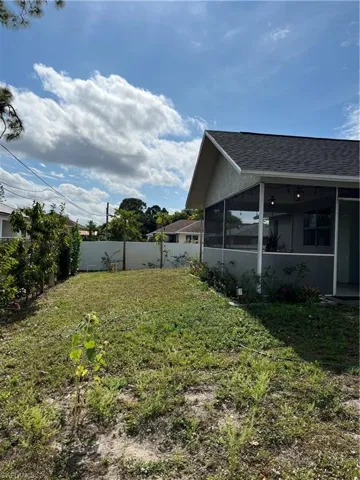 View of yard featuring a sunroom