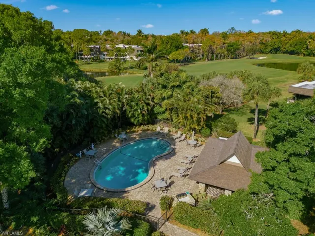 Aerial view of a local golf course and a tree filled landscape