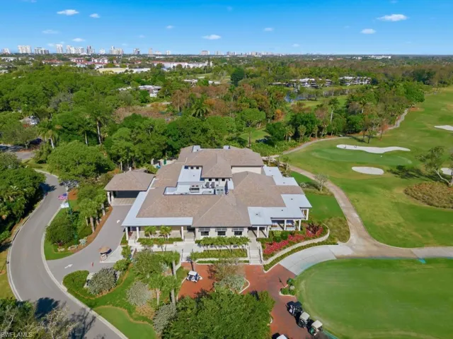 Aerial view of a golf club and a tree filled landscape