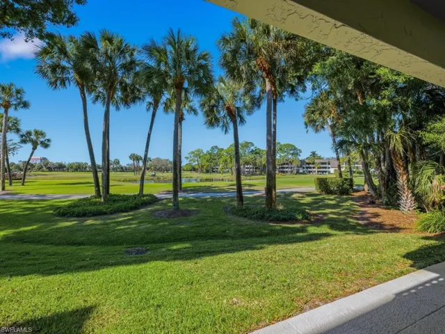 View of property's community with a water view and golf course view