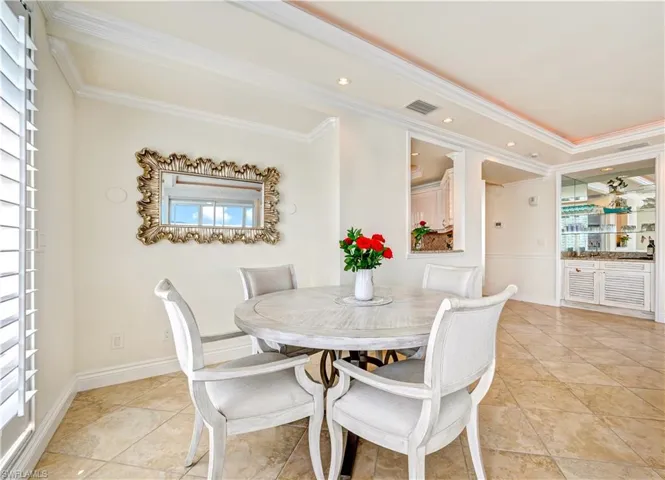 Dining space with crown molding