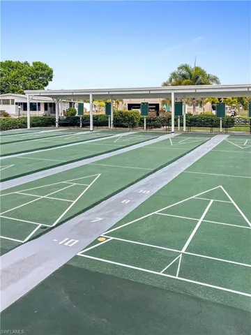 View of property's community with shuffleboard