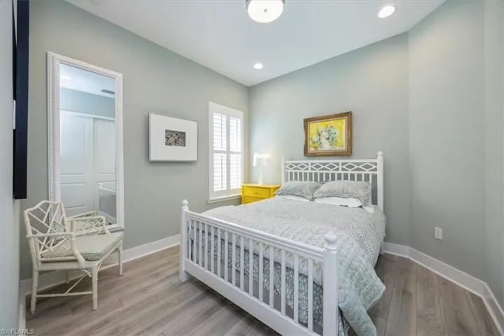 Guest Bedroom #2 with recessed lighting and plantation shutters