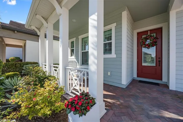 View of exterior entry with upgraded hardie board siding and covered porch