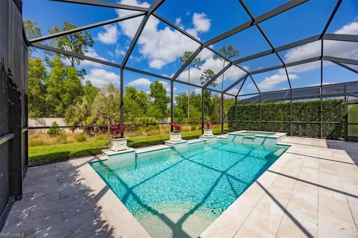 Salt water heated pool and spa, travertine deck