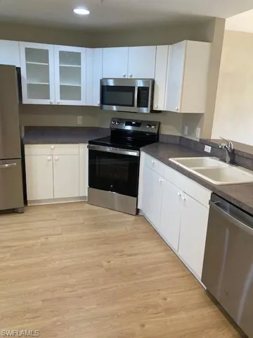 Eat-in kitchen with new microwave, stove, dishwasher