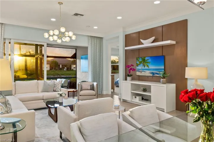 Living room with a chandelier, light tile patterned floors, visible vents, and recessed lighting