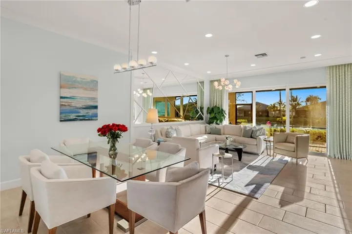 Dining room with baseboards, visible vents, a notable chandelier, and recessed lighting