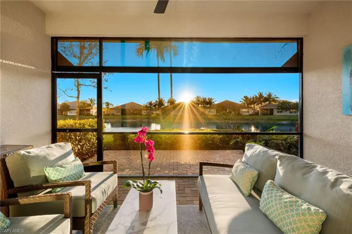 Sunroom / solarium with a water view