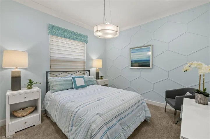 Carpeted bedroom with baseboards